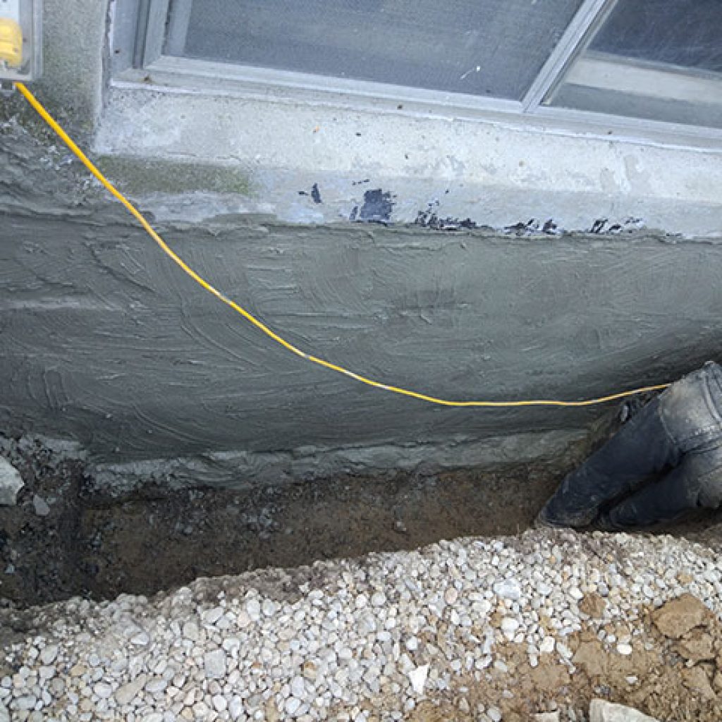 concrete wall waterproofing under basement window