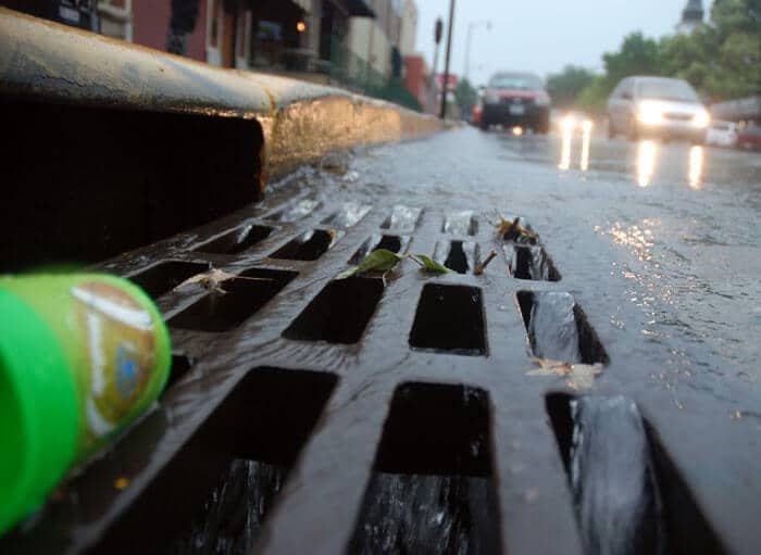 close view of catch basin in the rain