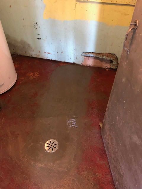 basement drain installed near water heater