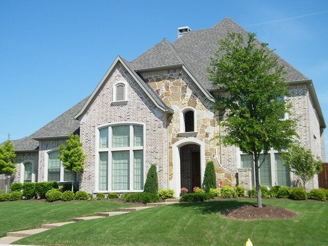 house with landscaping done sloping water away from foundation