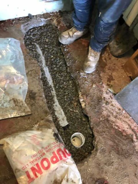 Drain being replaced by a plumber