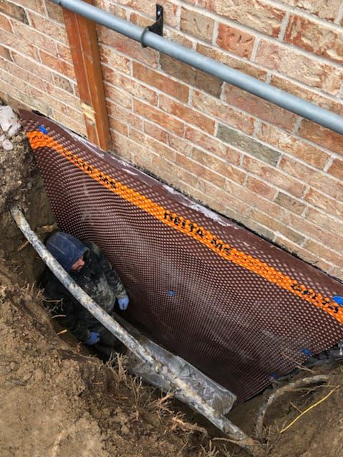 basement with leaking basement walls being waterproofed in Toronto