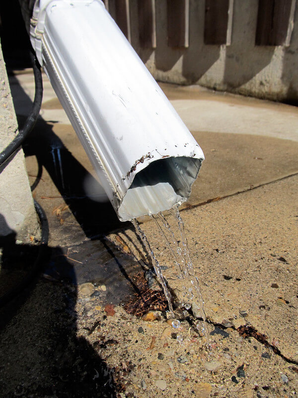 downspout near foundation causing cracks in the concrete