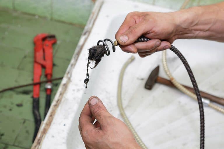 drain snaking hook with extracted debris