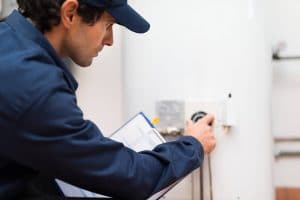 technician turning off water heater