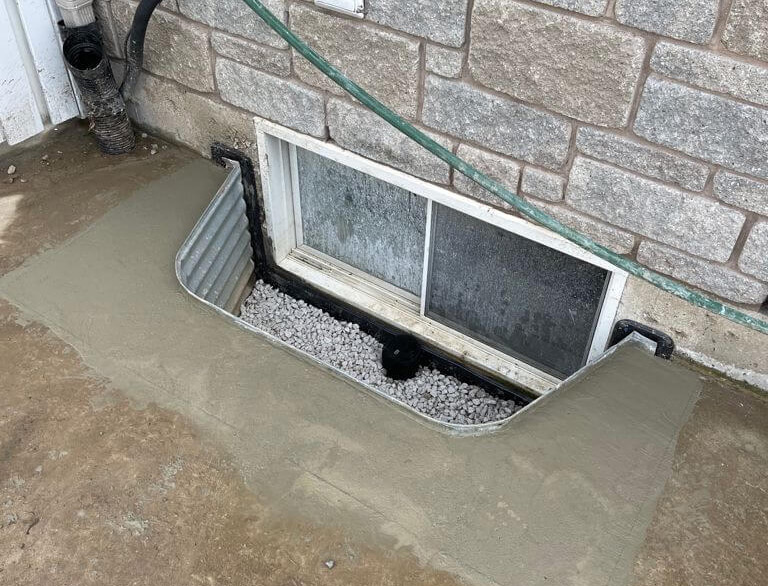 Window well installation drain repair