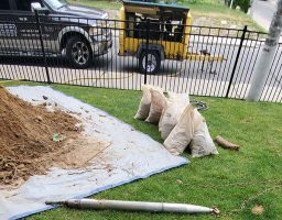 front yard and plumbing truck